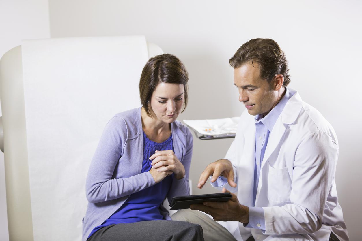 male doctor with female patient in a consultation