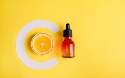 vitamin c serum on yellow background