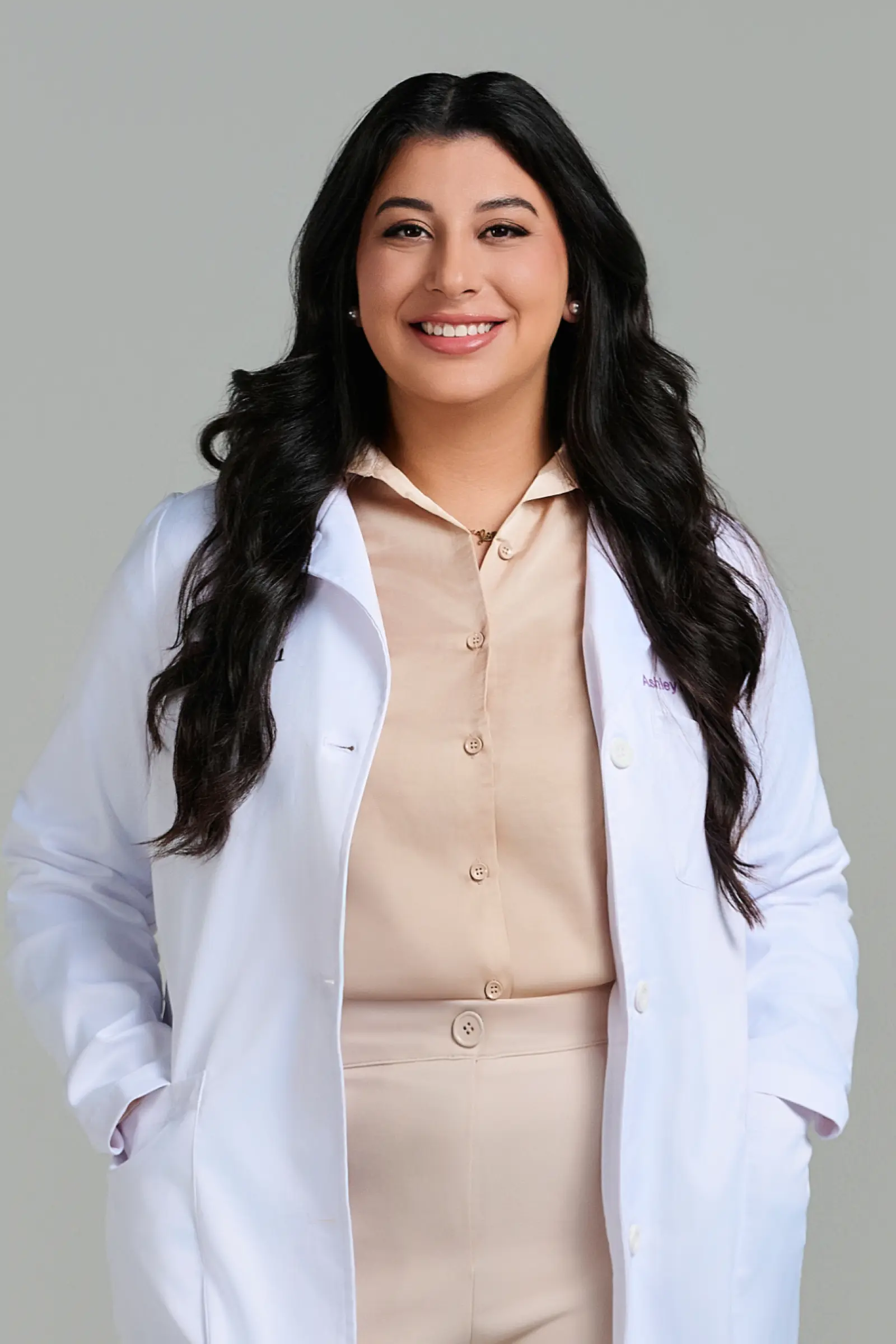 Smiling female doctor in white coat