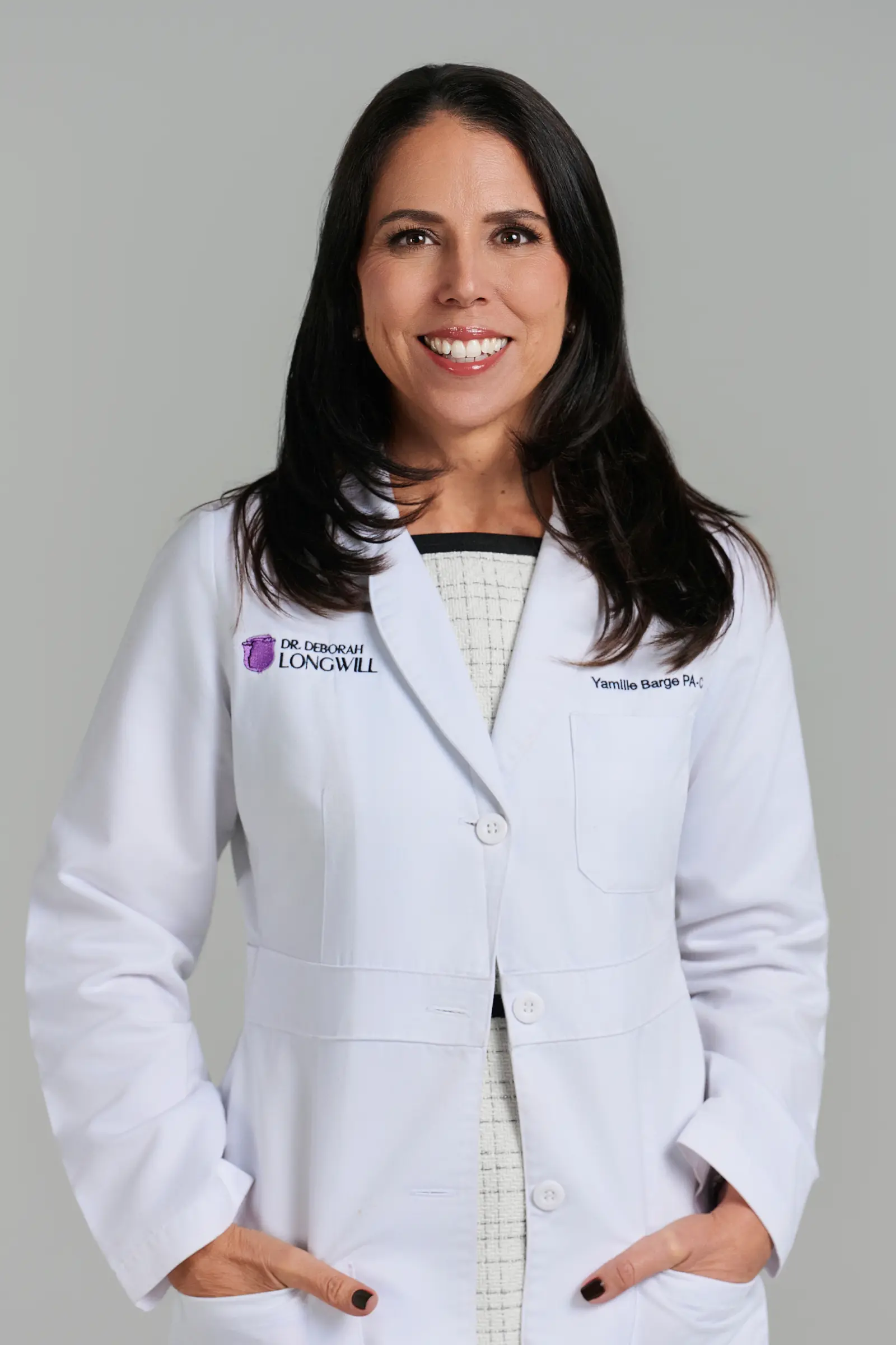 Female doctor smiling in white coat