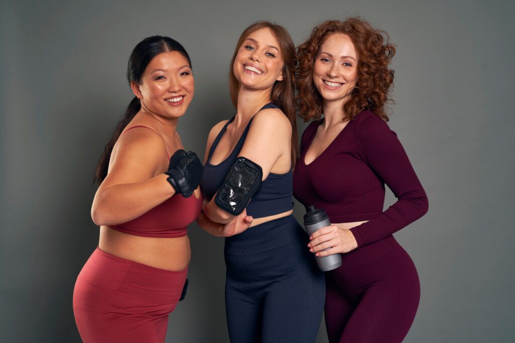 Smiling women in colorful workout outfits