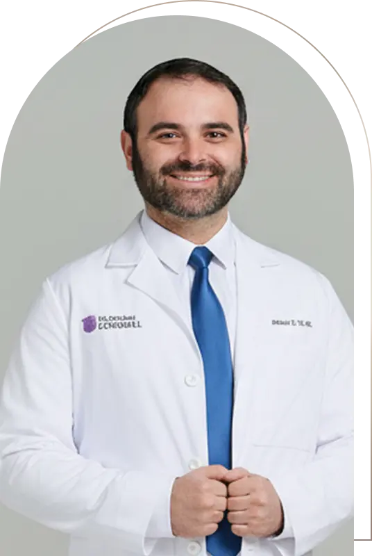Smiling male doctor in white coat and tie