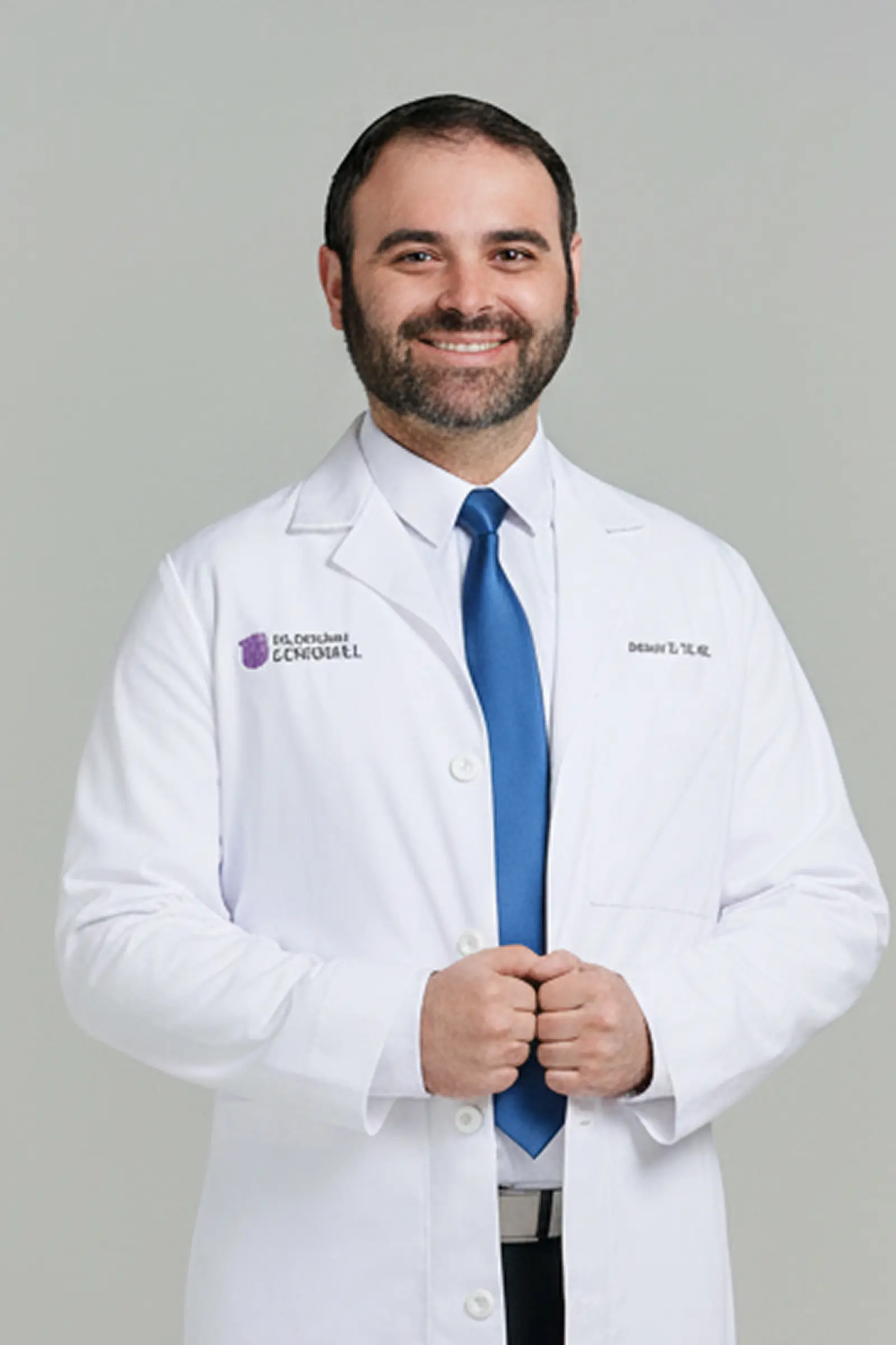 Male doctor smiling in white coat