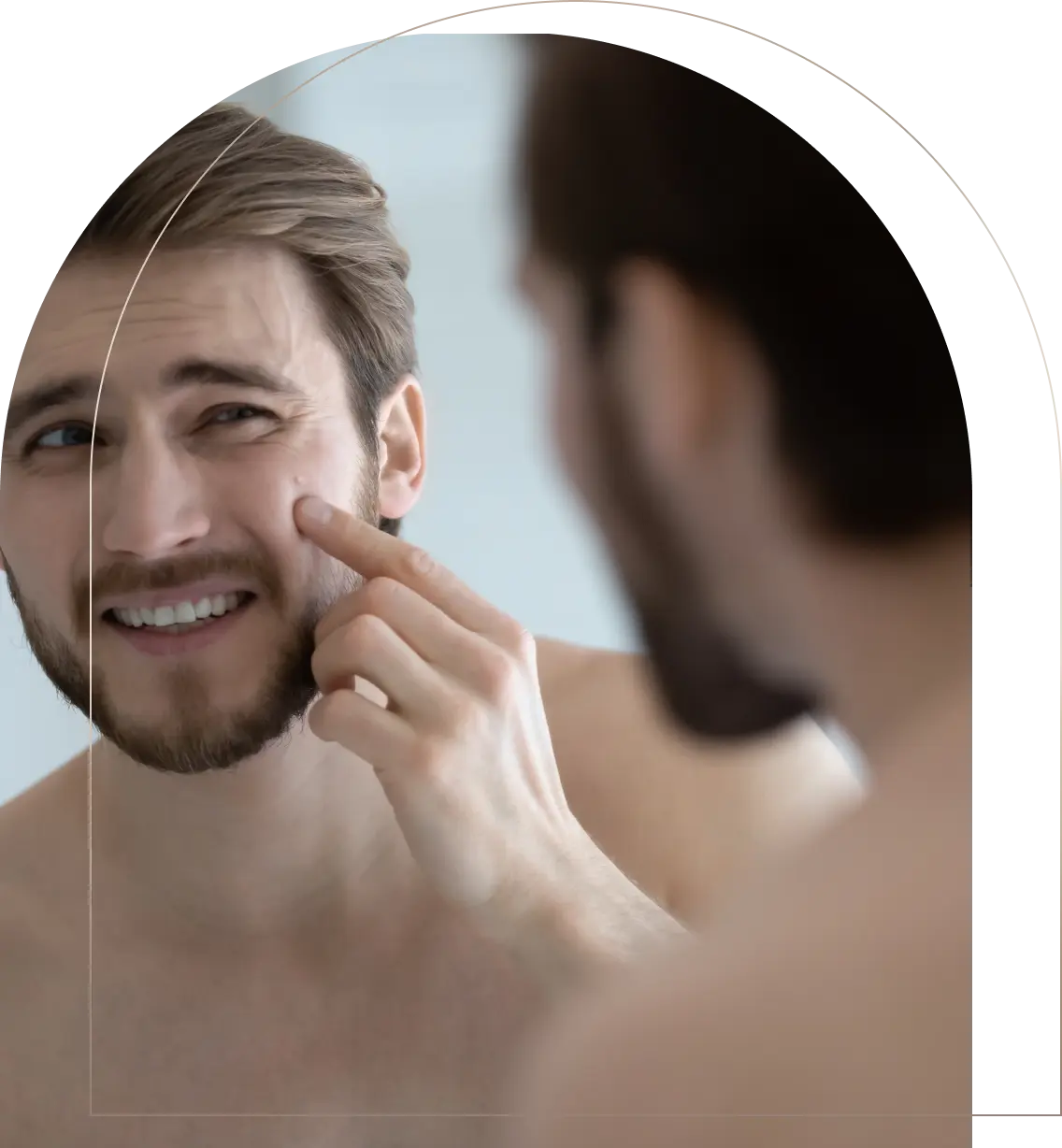 Young man examining acne on cheek in bathroom mirror Man checking acne on cheek in mirror
