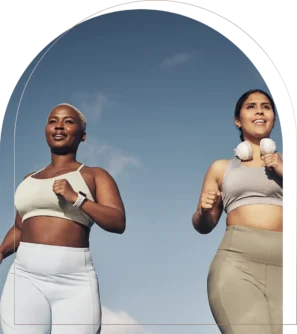 Women jogging outside in fitness clothing