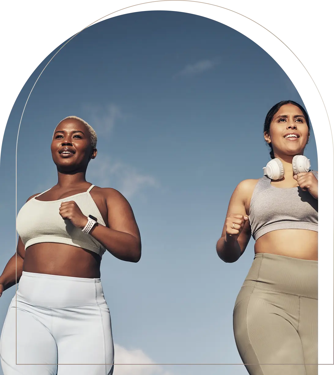 Women jogging outside in fitness clothing