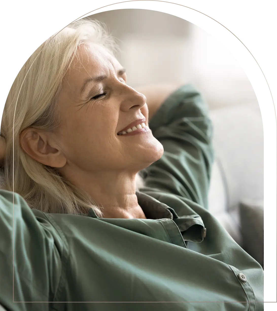 Relaxed elderly woman smiling with eyes closed