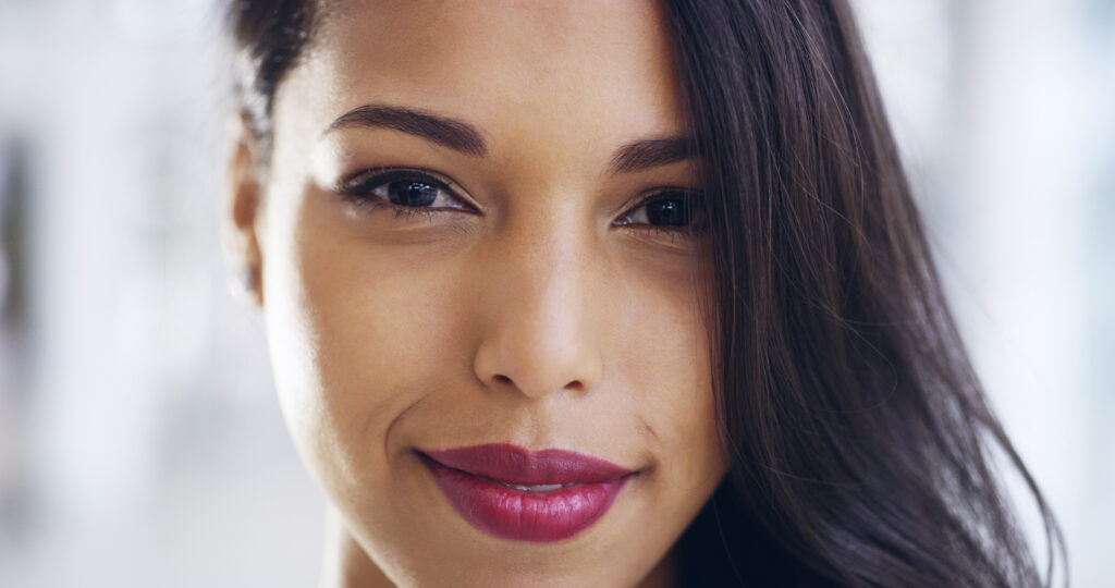 Woman smiling close-up with dark hair